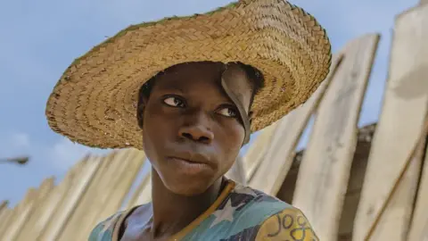 BBC Man with straw hat on his head