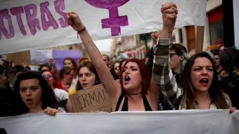 Reuters People shout slogans during a protest after a Spanish court condemned five men accused of the group rape of an 18-year-old woman, in Malaga