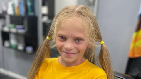 Boy seven has hair chopped by 17 inches for wig charity