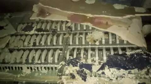 Laura Miller lighting and sound controls from 1970 covered in dust and debris