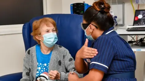 PA Media Margaret Keenan receiving vaccine