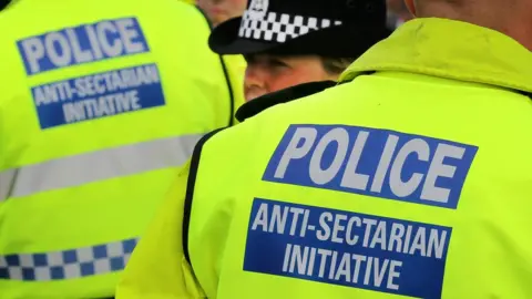 PA Media photo dated 18/09/11 of police wearing Anti-Sectarian Initiative jackets at the Old Firm match between Glasgow Rangers and Glasgow Celtic at Ibrox, Glasgow.