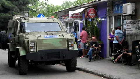 Getty Images A Georgian police car patrols the streets of Tbilisi, June 2020