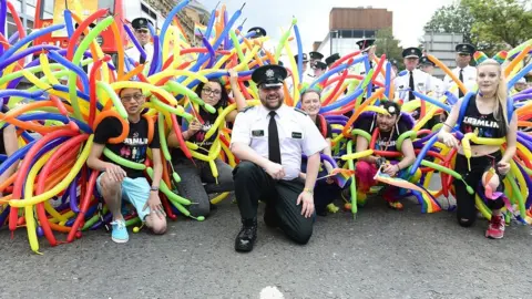 Pacemaker PSNI officers pose with LGBT activists at the Pride parade in Belfast in 2018