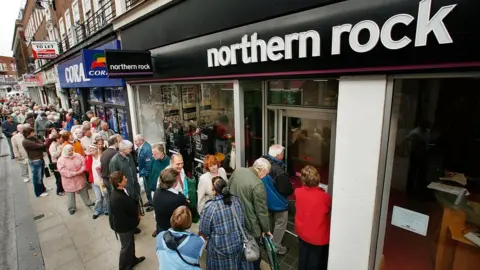 Getty Images People queuing outside a Northern Rock at the height of the banking crisis