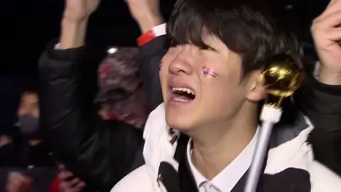 A South Korea fan crying