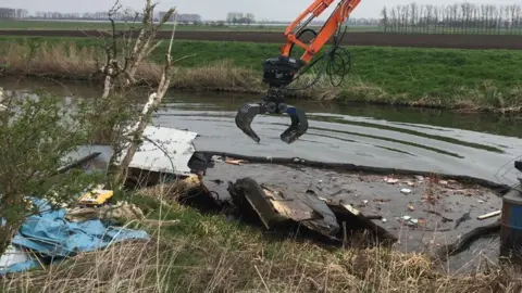 Environment Agency Wreckage of boat in river