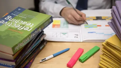 PA Teacher marking work