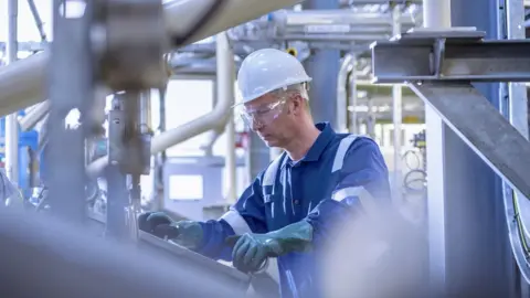 Getty Images Oil refinery worker