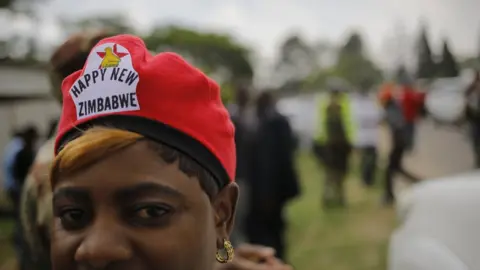 EPA People wait for the rumoured arrival of Zimbabwean former vice president Emmerson Mnangagwa, at an air force base in Harare, Zimbabwe, 22 November 2017