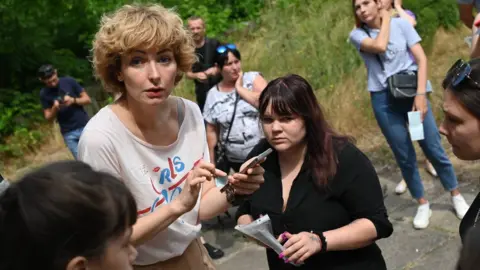 Tatyana Kumok Tatyana Kumok helping distribute aid