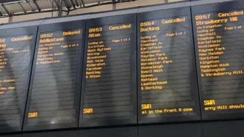 Samantha Massey Departure boards showing delayed or cancelled messages