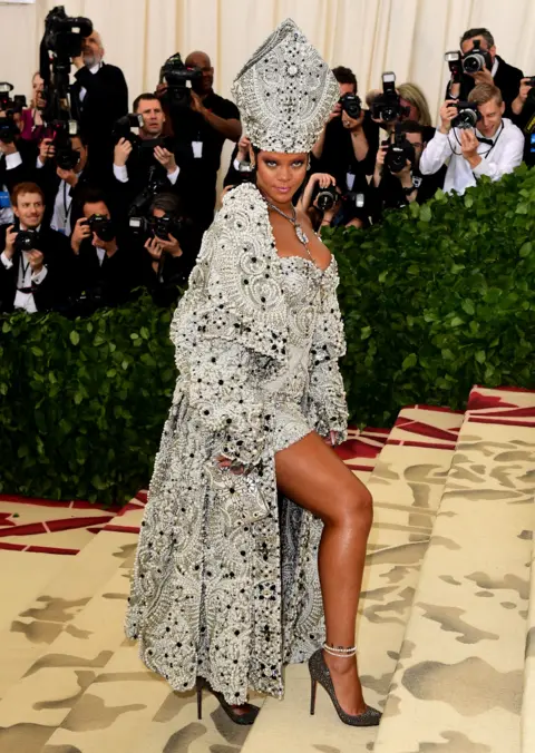 PA Rihanna wears a papal-inspired gown in honour of this year's theme.