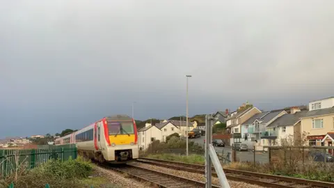 BBC Train going over the railway crossing