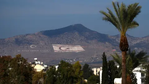 Getty Images A Turkish flag painted on to a hillside in Nicosia, northern Cyprus