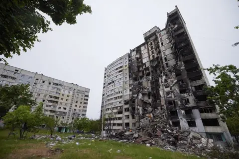 EPA/UKRAINIAN PRESIDENTIAL PRESS SERVICE A destroyed residential tower block in Kharkiv, Ukraine, pictured on 29 May 2022