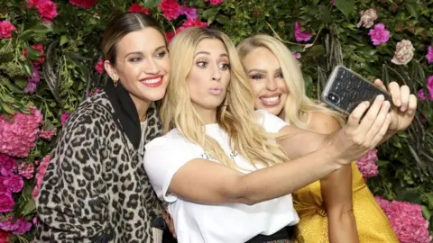 Getty Images Ashley Roberts (left) and Katie Piper (right) with Stacey Solomon at the launch of her Primark collection