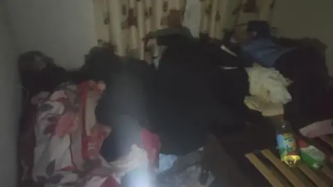 Cramped conditions in Maxim's flat in Mariupol