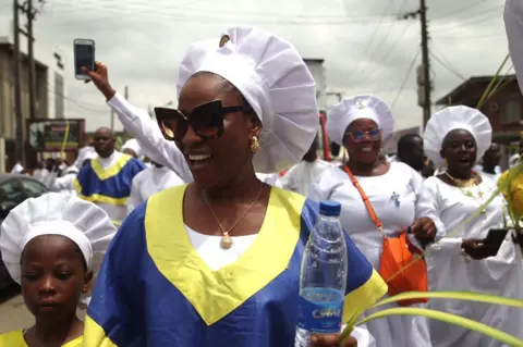 EPA Celestial Church of Christ members participate in a procession during Palm Sunday, Lagos, Nigeria - 02 Apr 2023