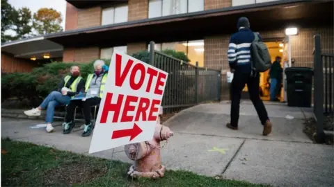 EPA Voters arrive to cast their ballots at the W I Patterson Community Center in Durham, North Carolina, USA, 03 November 2020