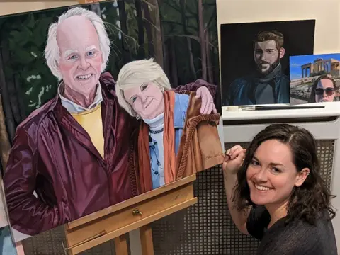 Ellie Clark Ellie Clark and her painting