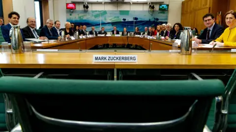Reuters A meeting of the DCMS committee empty-chairing Mark Zuckerberg