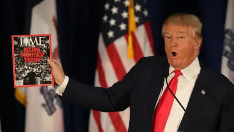 Getty Images Donald Trump holding Time magazine