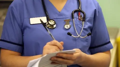 Nurse writing notes