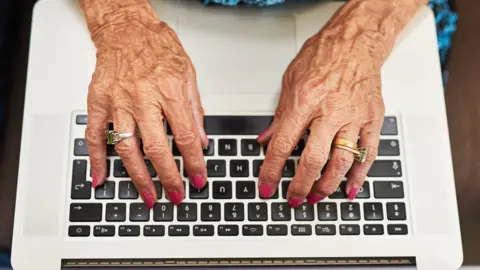 Getty Images Hands on keyboard