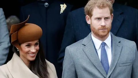 AFP Meghan Markle and Prince Harry at Sandringham service on Christmas Day