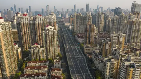 Getty Images Empty roads during a phased lockdown due to Covid-19 in Shanghai, China, in April 2022