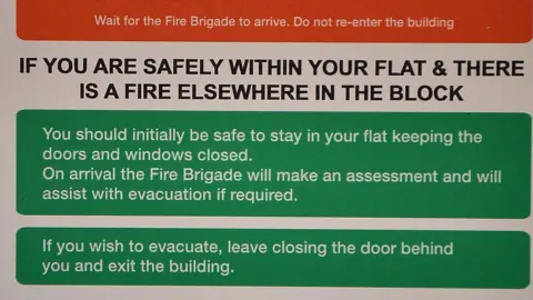 Getty Images A fire action sign from a block near Grenfell Tower