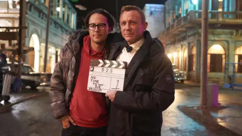 Bonhams Cary Joji Fukunaga and Daniel Craig on the No Time To Die set