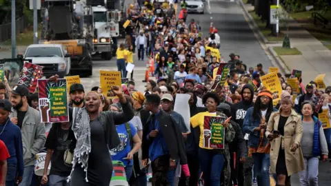 Getty Images Hundreds marched for better access to healthy food in 2017 in a neighbourhood of Washington, DC