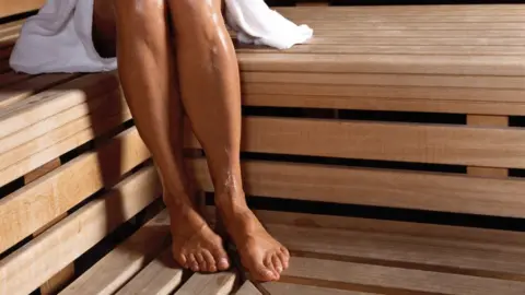 Getty Images A woman in a sauna