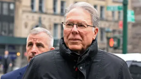 Getty Images Wayne LaPierre outside the New York State Supreme Court Building in Lower Manhattan on 23 February 2024