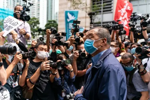 Getty Images Hong Kong media tycoon and founder of Apple Daily newspaper Jimmy Lai arrives at the West Kowloon Magistrates' Court on May 18, 2020 in Hong Kong,