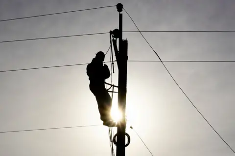 BBC Engineer repairing power lines