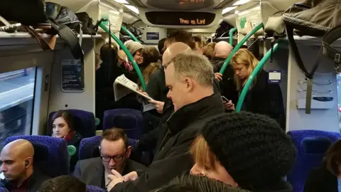 Kwaziicat Passengers on Edinburgh to Glasgow train