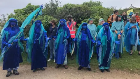 Extinction Rebellion protesters in blue