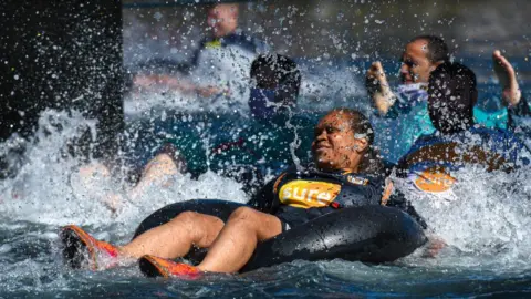 JONATHAN BURTON - PHOTOGRAPHER Competitors in the snake race