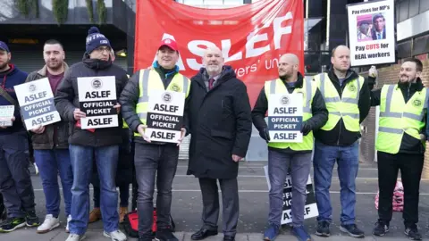 PA Media Mick Whelan on the picket line