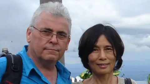Handout Peter Humphrey with wife Yu Yingzeng