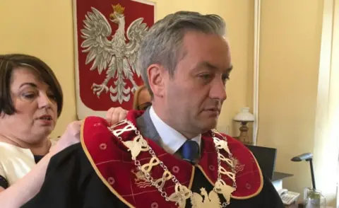 BBC Robert Biedron in his mayor's garb in Slupsk