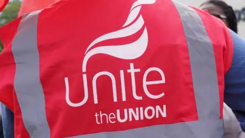 PA Media Members of the Unite union on a picket line