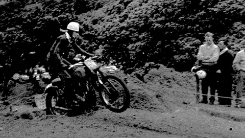 Family photo Colin Burrow riding his bike as a young man