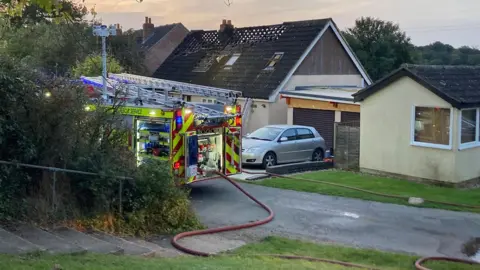 Fire engines at a house