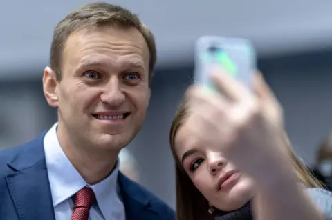 EPA Alexei Navalny poses for a selfie with a student in Strasbourg, 15 November 2018