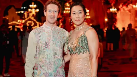 Reuters Meta CEO Mark Zuckerberg and his wife Priscilla Chan pose during the pre-wedding celebrations of Anant Ambani, son of Mukesh Ambani, the Chairman of Reliance Industries, and Radhika Merchant, daughter of industrialist Viren Merchant, in Jamnagar, Gujarat, India, March 2, 2024.