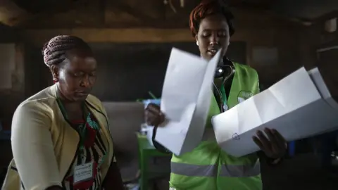 EPA Electoral officials count votes for the presidential poll at a polling station near Isinya, Kajiado County, some 60km south of the capital Nairobi, Kenya, 08 August 2017.